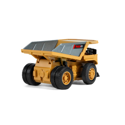 Rear low angle view of the BRRRRT mini dump truck showing the dual rear tires, chassis details, and back of the alloy bed