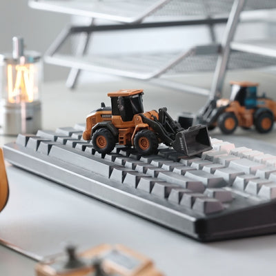 BRRRRT 1/64 Mini RC Wheel Loader on keyboard